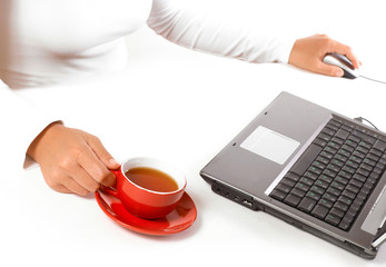 Hands of business woman with mouse and coffee