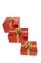 Three Christmas gifts in a row isolated on white
