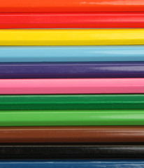 Macro texture of a row of colored pencils