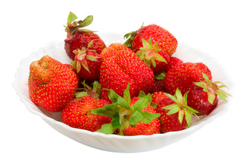 many ripe strawberries on plate, isolated on white