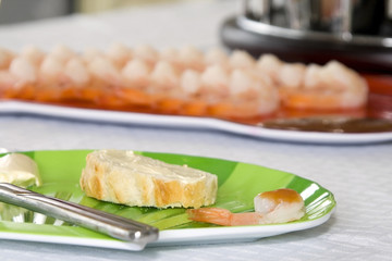 Sliced bread with blurred shrimps on the background