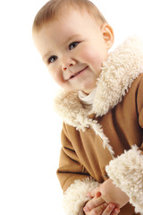 Cute child wearing fur coat, isolated over white