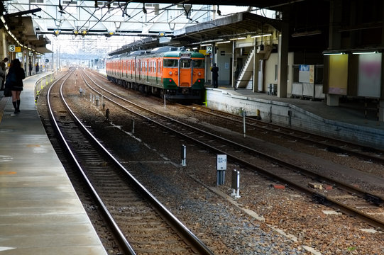 Commuter train arriving at a train station