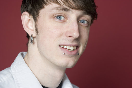 Portrait Of A Young Man With Pierced Ears And Lips