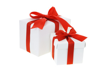 Two gift boxes with red bow ribbons on white background