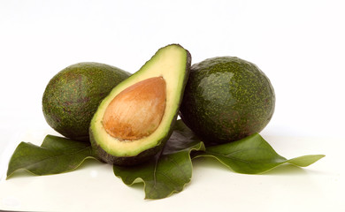 avokados and avocado section  isolated on white background