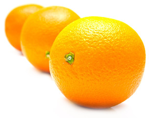 The ripe whole oranges with real reflexion on white. Isolation
