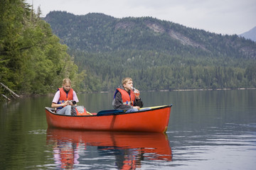Girl and boy canoeing, Canada