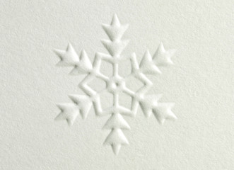 White embossed paper snowflake design