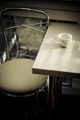 a Dining table with a cup