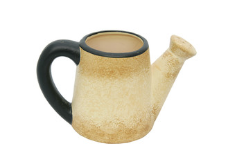 a yellow metal watering pitcher over white