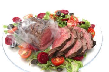 meat and vegetables on transparent dish