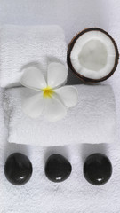 Obraz na płótnie Canvas spa beauty exotic tropical flowers coconuts on white towels