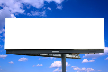Blank billboard against blue sky, put your own text here - obrazy, fototapety, plakaty