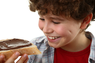 Boy eating bread with peanut butter