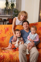 Happy family of the house on a sofa