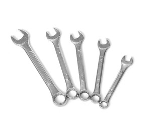 Various spanners on white background