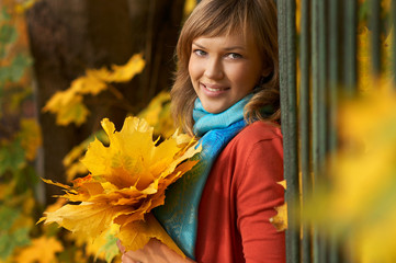 Beauty girl in a park in autumn