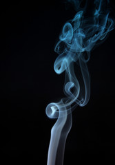 smoke from a cigarette in a black background