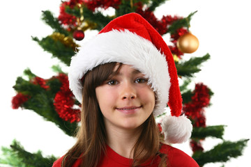 Christmas time - girl with Santa's hat isolated on white