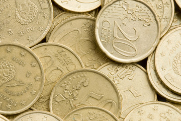 Macro of many coins cents Euro as background