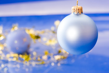 holiday series: christmas decorated blue ball with garland