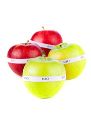 Red and yellow organic apples isolated on white