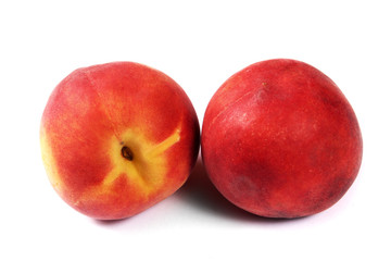 Fototapeta na wymiar Fresh two peaches isolated on white background