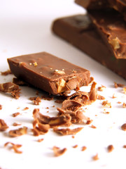 crumbled chocolate with hazelnuts over white