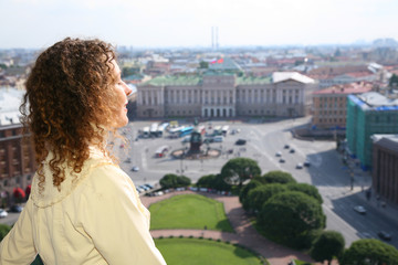 Fototapeta na wymiar Girl looks on St.Petersburg