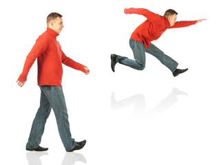 Young man in red sweater goes and jumps