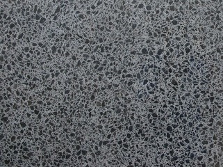 A texture photo of grey and black granite