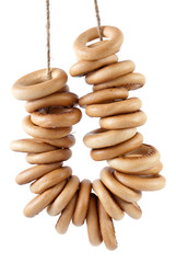 Some bread-rings hanging on rope isolated on the white