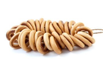 Some bread-rings on rope isolated on the white background