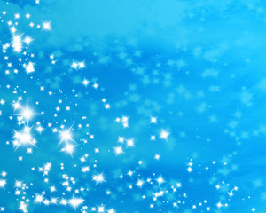 Fototapeta na wymiar glittering stars on a soft blue background
