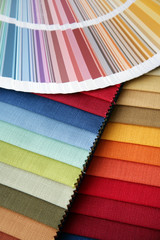 samples of a fabric and opened color card with various colors