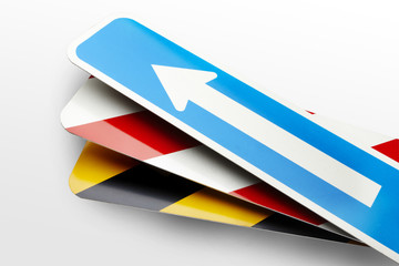 Arrow and Stripe Road signs on a white background