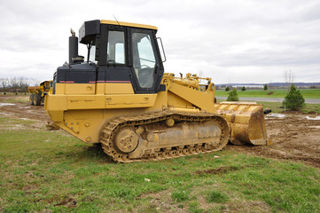 yellow bulldozer at a construction site