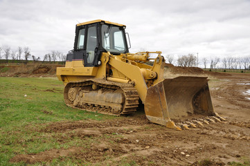 Obraz na płótnie Canvas yellow bulldozer at a construction site