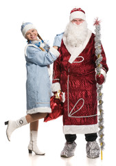 Snow girl embraces Santa Claus, they look at the camera