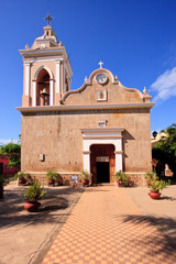 View down tiled path to door of El Quelite Church in Mexico © steheap