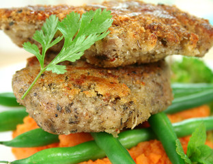 Crumbed lamb cutlets on green beans andpotato mash