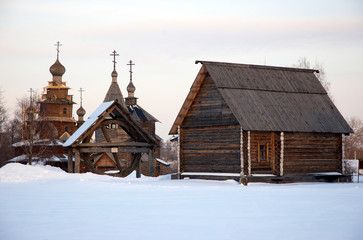 old russian wooden village with church, building and well