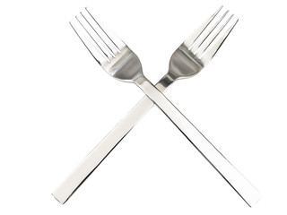 Crossing silver forks against the white background
