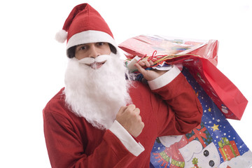 Young Man in Santa costume, full of gifts - isolated over white
