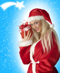 blond santa claus holding a red present box and smiling