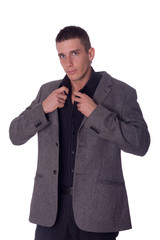 young businessman getting dressed