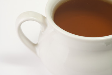 closeup of a white cup of tea