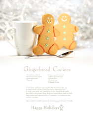 Hot holiday drink with gingerbread cookies on festive background