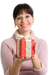 young brunette holding red Christmas present isolated over white